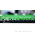 Syntetisk græsgolf sætter grønt med golfflag